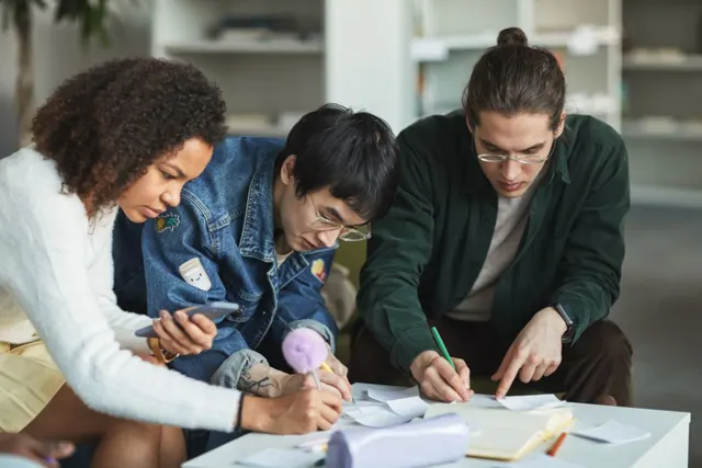 Students working through notes together